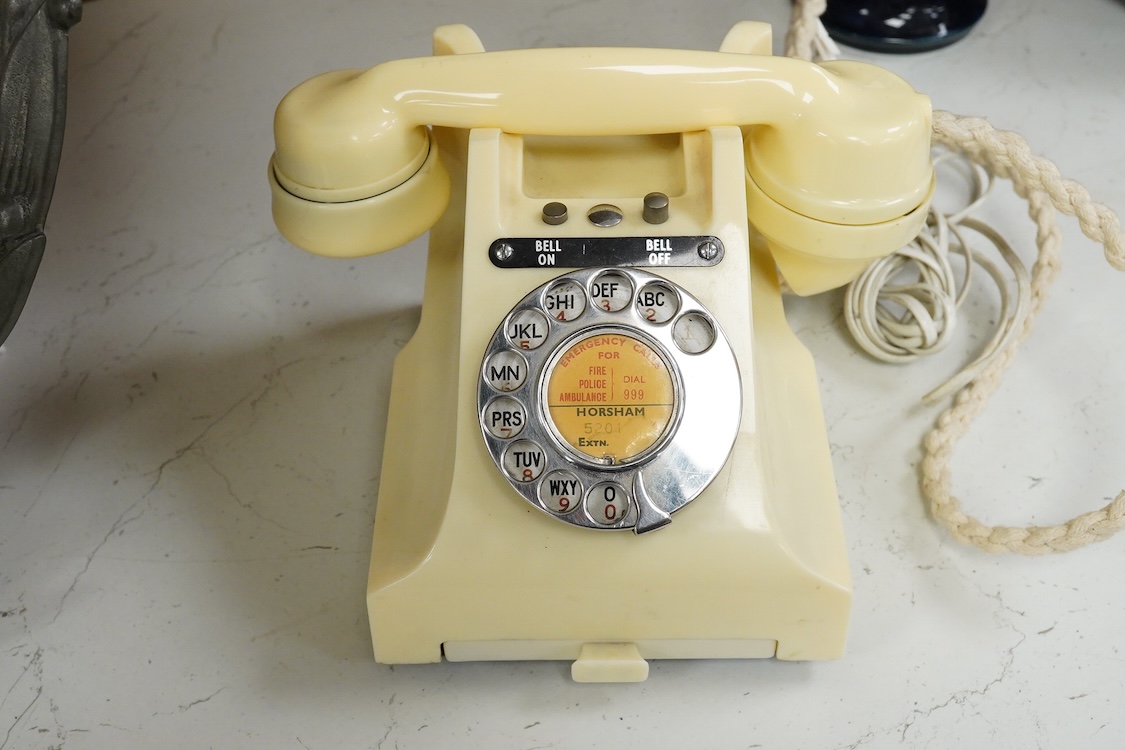 A GPO telephone model 312 in ivory, with a paper centre for a Horsham telephone number, the handset moulded with 164 56 under the grip, with some restoration and adaptations